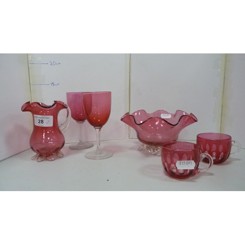 28 - Group of cranberry glass to include a jug, bowl, wine glasses and custard cups, also a green glass v... 