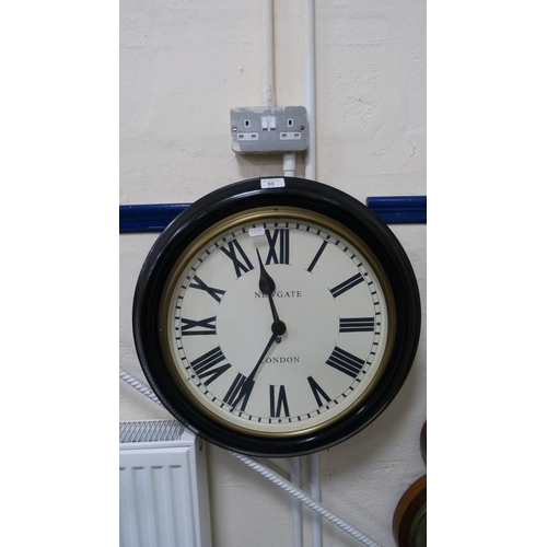 33 - Modern wall clock by Newgate of London.