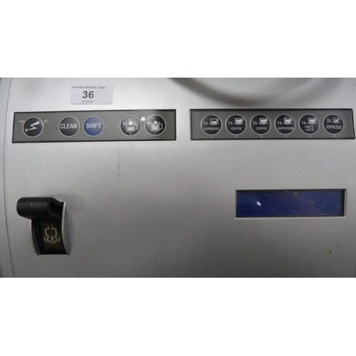 36 - Carimali commercial coffee machine, approximately 70cm high, with cleaning fluid and accessories.