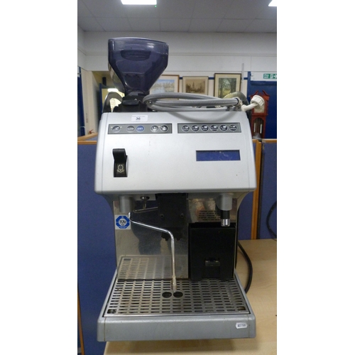 36 - Carimali commercial coffee machine, approximately 70cm high, with cleaning fluid and accessories.