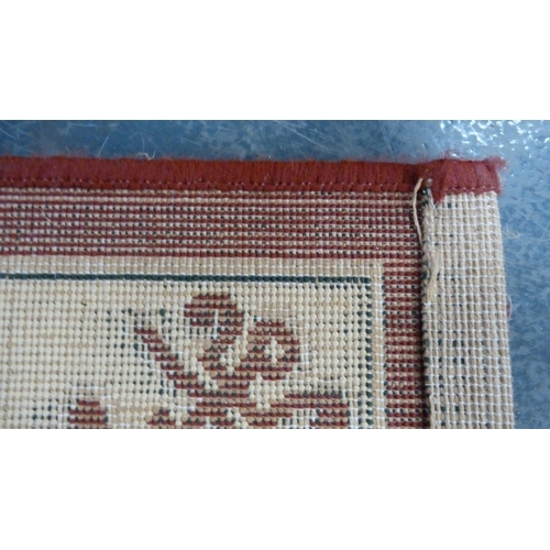 37 - Group of small modern machine-made rugs to include two Chinese-style examples and another.  (3)