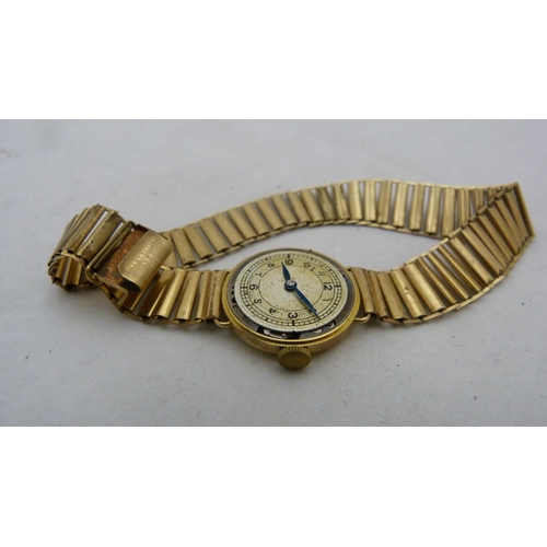 402 - 9ct gold-backed lady's wristwatch.