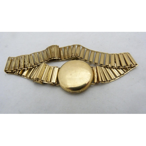 402 - 9ct gold-backed lady's wristwatch.