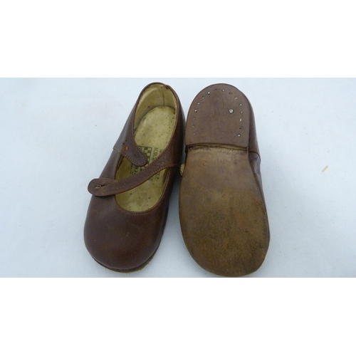 408 - Box of jewellery and collectables to include Pedigree dolls and a pair of child's shoes.