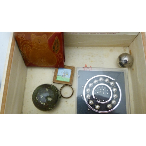 410 - Box of curios to include an Indian brass box, bangle, spectacles etc.