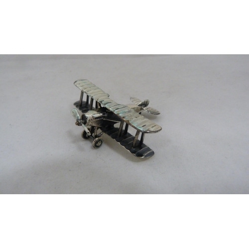 412 - Silver (925) miniature model of a biplane, 20g.