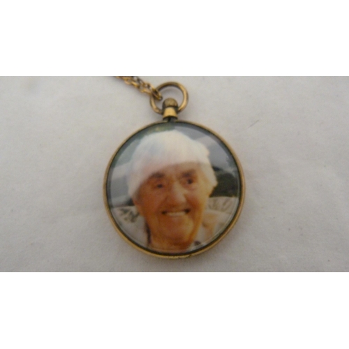 414 - Victorian lady's silver-cased fob watch with enamel dial, 32g gross, rolled gold photo pendant on ch... 
