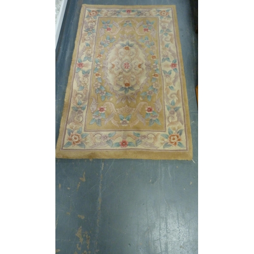 415 - Chinese-style rug on beige ground.