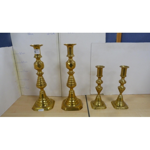 42 - Pair of brass beehive candlesticks and another smaller pair. 