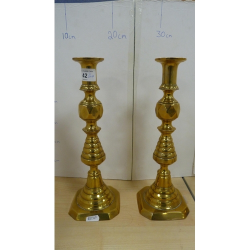 42 - Pair of brass beehive candlesticks and another smaller pair. 