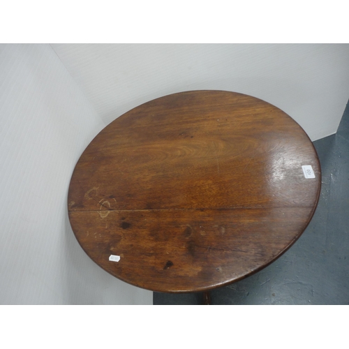 420 - George III mahogany snap-action tripod table with saucer top, approximately 70cm high.