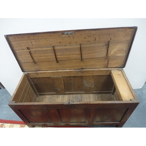 421 - 19th century oak coffer with hinged top enclosing a pine candle box, three-panel front, iron lock, o... 