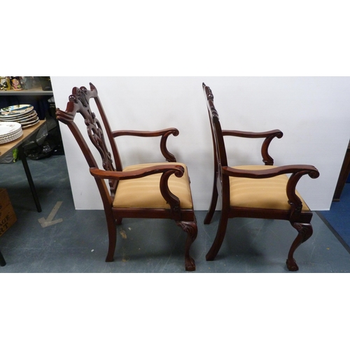 429A - Pair of Chippendale-style mahogany elbow chairs with acanthus decoration and slip-in seats, on ball ... 