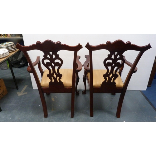 429A - Pair of Chippendale-style mahogany elbow chairs with acanthus decoration and slip-in seats, on ball ... 