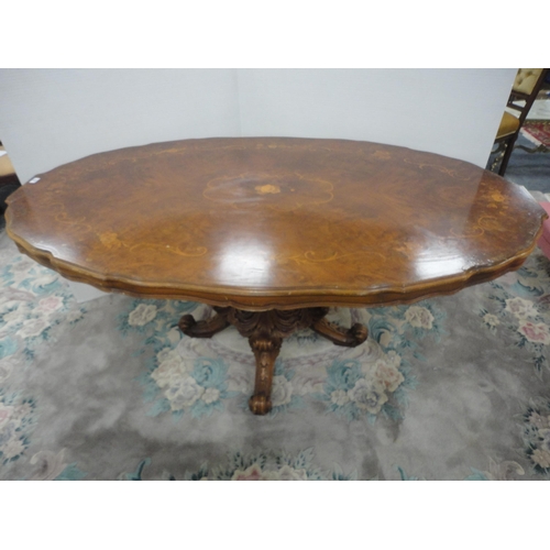 430 - Italian Sorrento-style walnut dining table with scroll inlay to the shaped top, on turned and carved... 