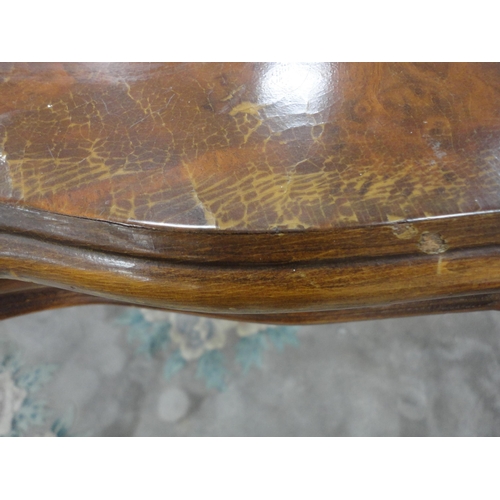 430 - Italian Sorrento-style walnut dining table with scroll inlay to the shaped top, on turned and carved... 