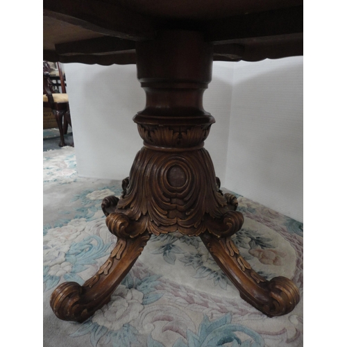 430 - Italian Sorrento-style walnut dining table with scroll inlay to the shaped top, on turned and carved... 