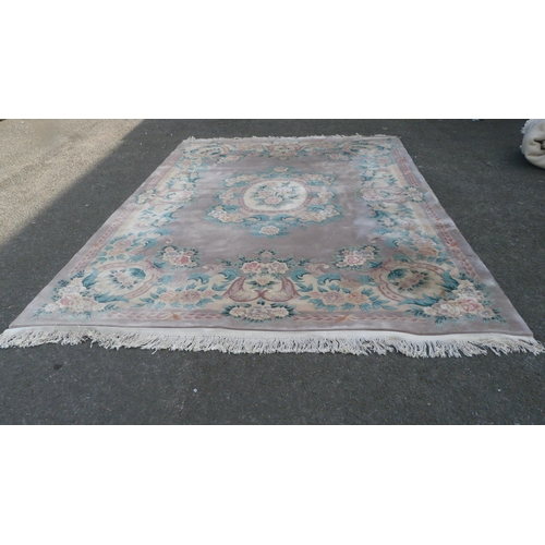 431 - Chinese-style rug on pale ground.