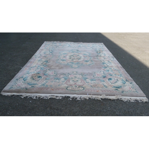 431 - Chinese-style rug on pale ground.