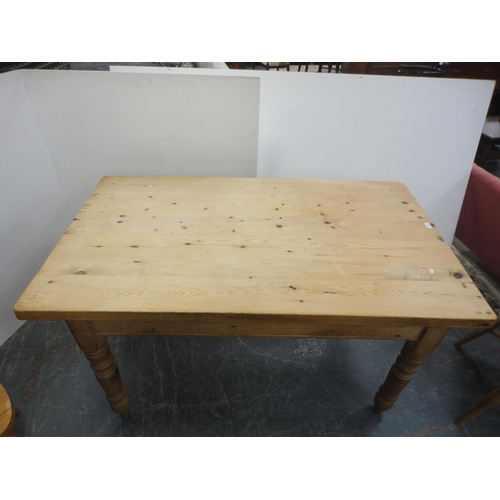 433 - Pine kitchen table and a set of six pine chairs, including one carver.  (7)