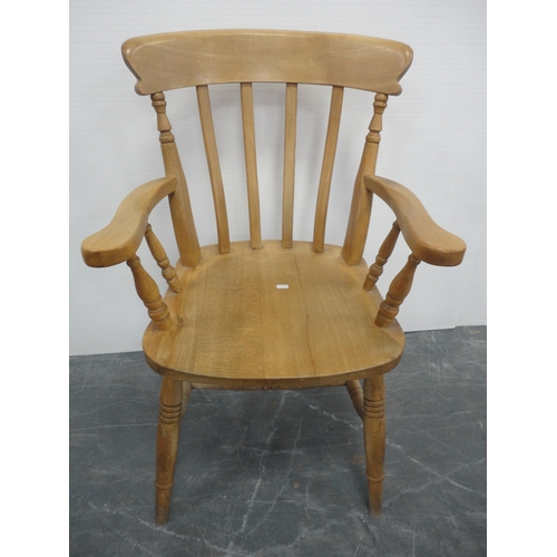 433 - Pine kitchen table and a set of six pine chairs, including one carver.  (7)