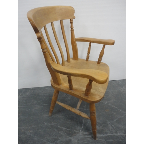 433 - Pine kitchen table and a set of six pine chairs, including one carver.  (7)