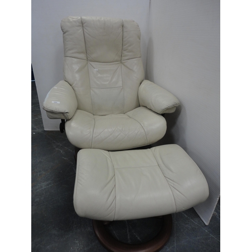 440 - Contemporary stressless style recliner armchair and footstool.  (2)