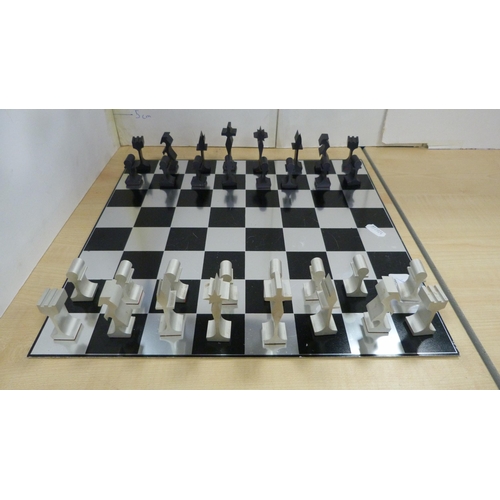 45 - Contemporary chess board with aluminium pieces and an unframed print of the first Blackburn monoplan... 