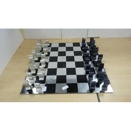 45 - Contemporary chess board with aluminium pieces and an unframed print of the first Blackburn monoplan... 