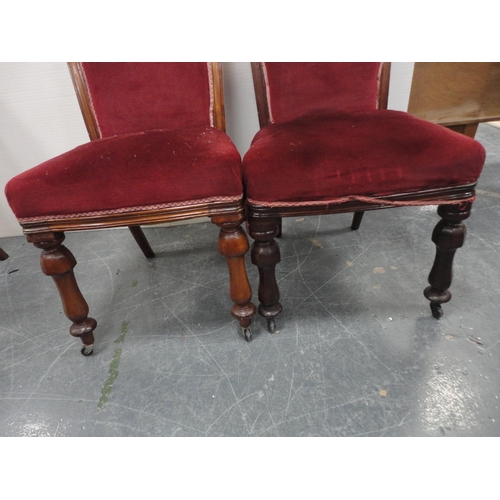 450 - Set of four Victorian mahogany dining chairs of graduated sizes, upholstered in later red velour, on... 