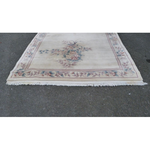 453 - Large Chinese-style cream rug.