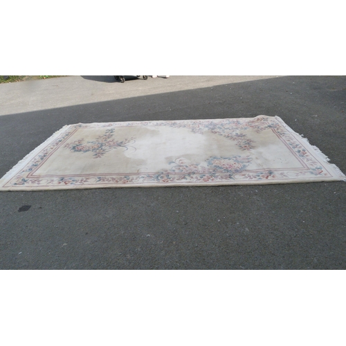 453 - Large Chinese-style cream rug.