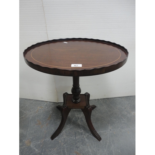 461 - Pair of oval mahogany occasional tables on quadripartite bases.