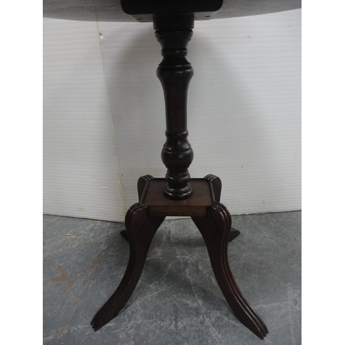 461 - Pair of oval mahogany occasional tables on quadripartite bases.