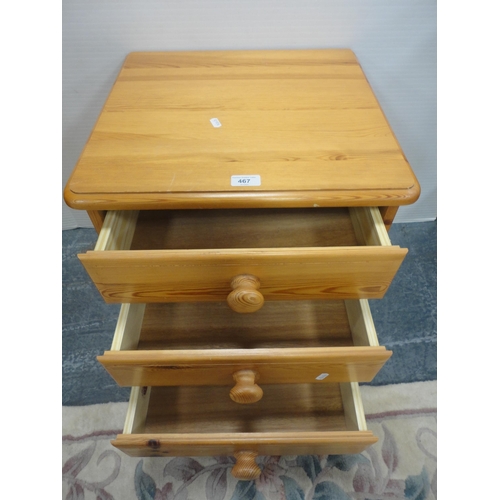 467 - Pine three-drawer bedside chest.