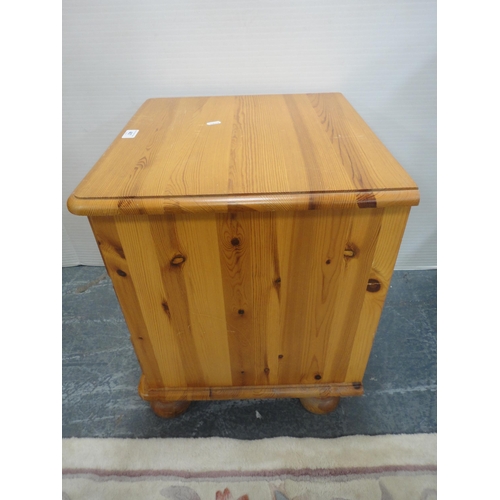 467 - Pine three-drawer bedside chest.