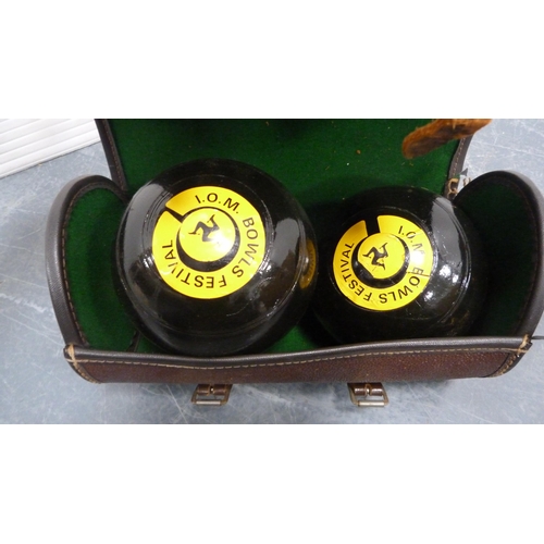 47 - Carton containing a bag with two lawn bowls, pair of contemporary dog bookends, brass-coated weights... 