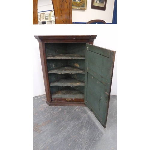 478 - Late 18th century oak corner cupboard with panelled door enclosing shelving, 108cm high, 82cm wide a... 