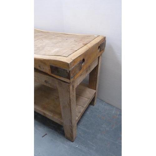 485 - French-style pine butcher's block with shaped, curved top, metal brackets, on a pine stand, c. 1920,... 