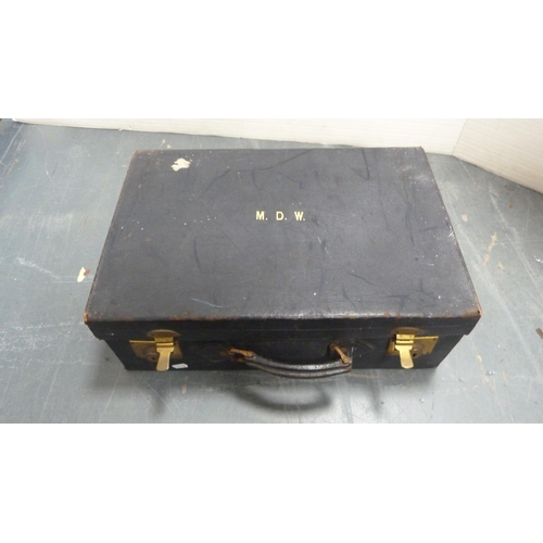 486 - Brown leather travel case and another, initialled 'MDW'.  (2)