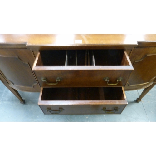 487 - Reproduction mahogany breakfront sideboard with two short drawers flanked by cupboard doors, on tape... 