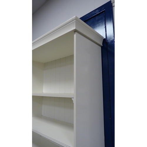 492 - Tall white open bookcase.