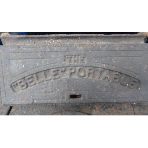 496 - 'The Belle Portable' cast iron range, with lift-off compartments to the top section, with flue, abov... 