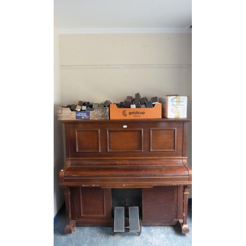 497 - Upright pianola by Crane & Sons Ltd., cased in mahogany, and a large quantity of pianola rolls.