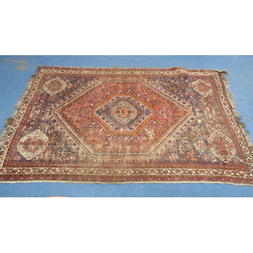 502 - Persian Shiraz hand-knotted rug in Caucasian colours, with geometric medallion to the centre flanked... 