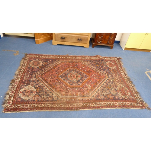 502 - Persian Shiraz hand-knotted rug in Caucasian colours, with geometric medallion to the centre flanked... 