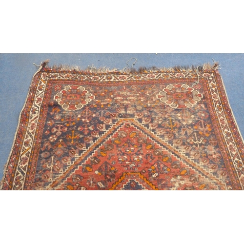 502 - Persian Shiraz hand-knotted rug in Caucasian colours, with geometric medallion to the centre flanked... 