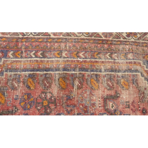 502 - Persian Shiraz hand-knotted rug in Caucasian colours, with geometric medallion to the centre flanked... 