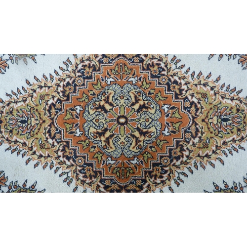 517 - Turkish Saray oval rug, and a similar circular rug,  (2)