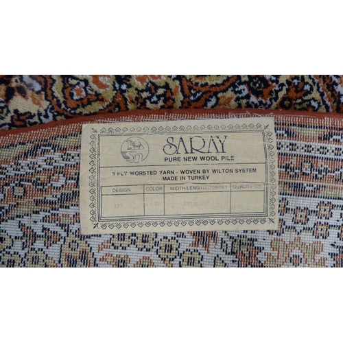 517 - Turkish Saray oval rug, and a similar circular rug,  (2)